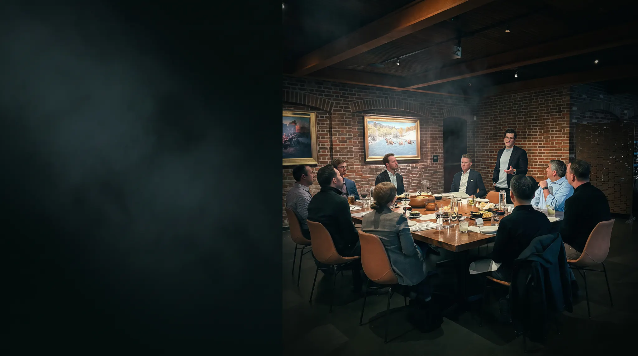 TEN members gathered around a private roundtable as one member speaks